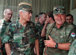 General Clark on the left with General Mladic's hat on.... General Mladic on the right with General Clark's hat.