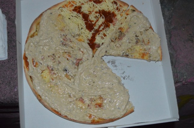pizza with something called "beef sauce" smeared all of it